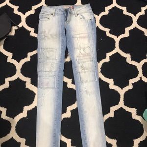 Washed out patched skinny jeans